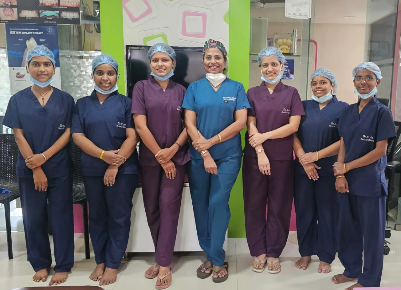 Dr. Smita Kole with the Dr. Kole Dental Clinic team