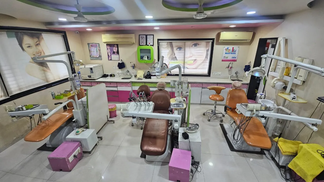 Treatment room at Dr. Kole Dental Clinic with three dental chairs